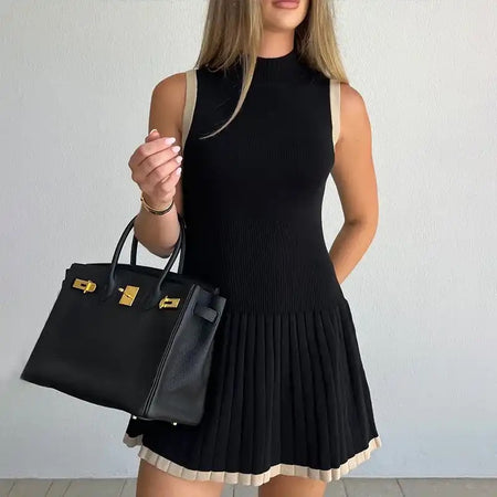 Abby Luxe Short Knit Dress - front shot on model holding bag, black and cream - Miss Mosa By Akanksha