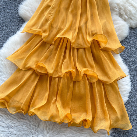 Adela Halterneck Ruffle Mini Dress - product shot, marigold orange - Miss Mosa By Akanksha