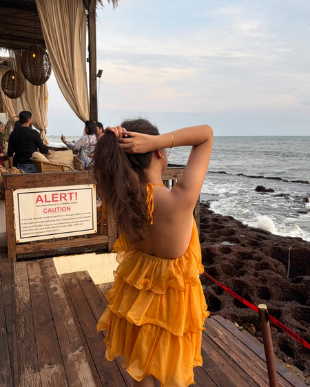Adela Halterneck Ruffle Mini Dress - front shot, marigold orange - Miss Mosa By Akanksha