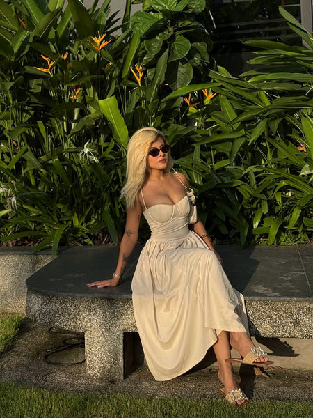 Agastha Midi Vintage Retro Dress In Beige - seated full-length shot on model of corset midi dress outdoors - Miss Mosa By Akanksha