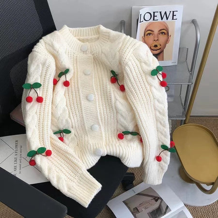 Alaine Statement Woolen Sweater with Cherry Detail - flat-lay shot on chair, cream - Miss Mosa By Akanksha