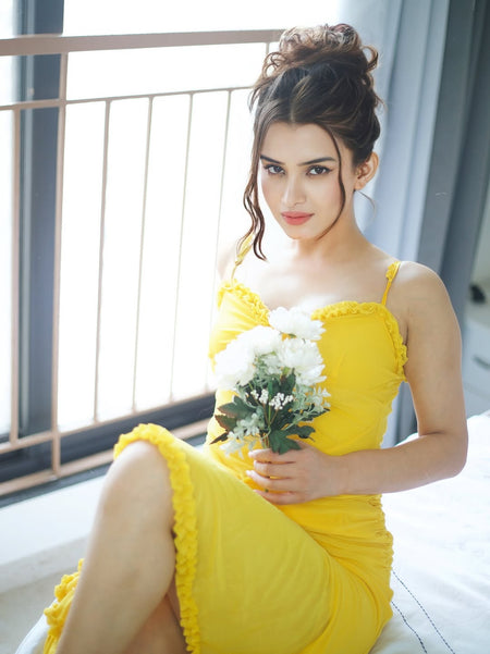 Alana Statement Bodycon Ruffled Dress In Yellow - front shot on model seated - Miss Mosa By Akanksha