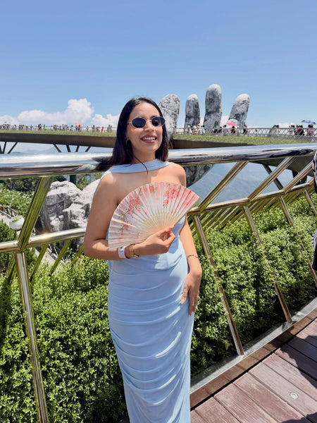 Alara Summer Set of Top And Skirt With Scarf In Sky Blue - front shot on model holding fan on bridge - Miss Mosa By Akanksha