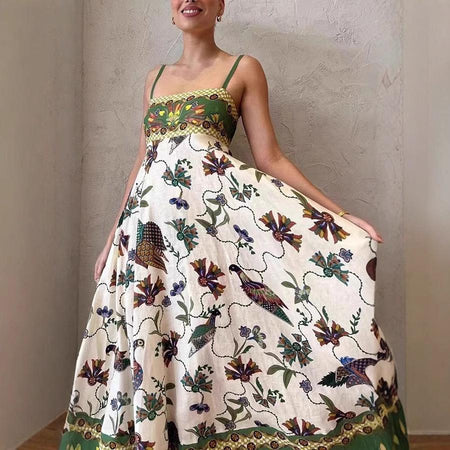 Alaric Printed Holiday Dress In Green - front shot on model holding out skirt - Miss Mosa By Akanksha