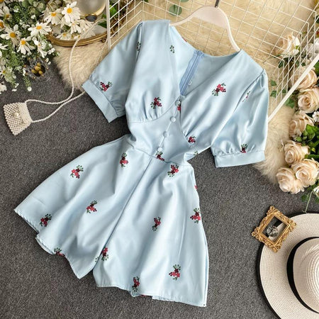 Alicia Floral Romper - back shot on hanger, light blue floral - Miss Mosa By Akanksha