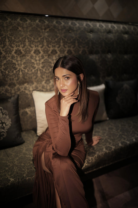 Alina Statement Slit Cut Maxi Dress - seated shot on model, brown - Miss Mosa By Akanksha