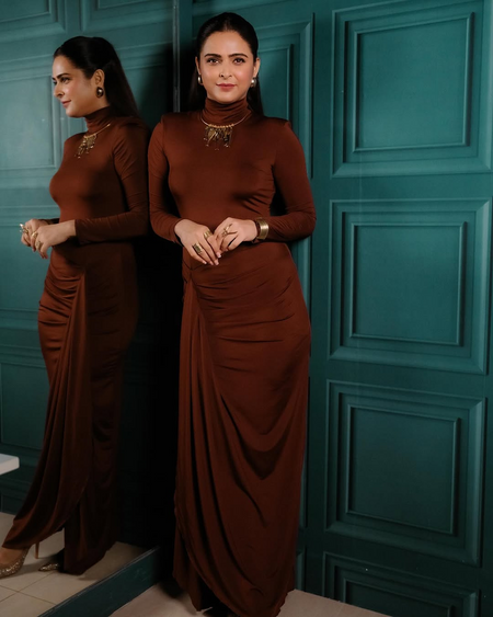Alina Statement Slit Cut Maxi Dress In Brown - full-length front shot on model beside a mirror - Miss Mosa By Akanksha