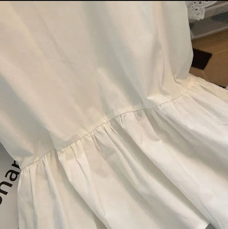 Alma Statement Summer Ruffled Top In White - close-up of peplum hem detail - Miss Mosa By Akanksha