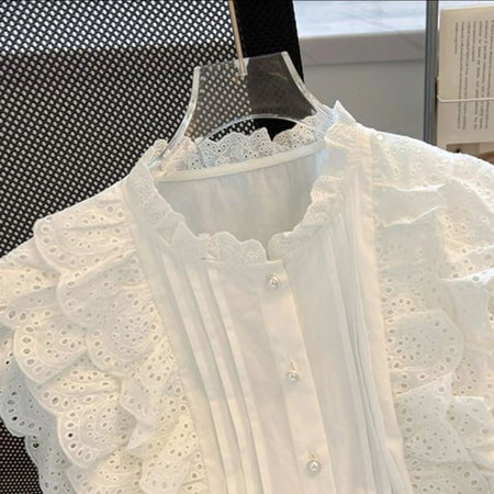 Alma Statement Summer Ruffled Top In White - close-up of ruffle and neckline detail on hanger - Miss Mosa By Akanksha