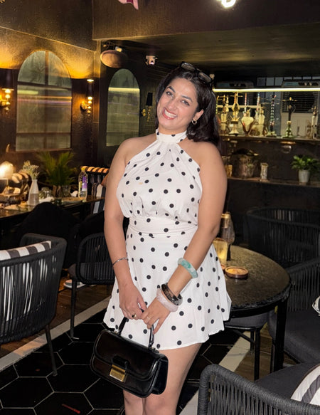 Andora Halterneck Polka Mini Dress - front shot on model, white with black polka dots - Miss Mosa By Akanksha