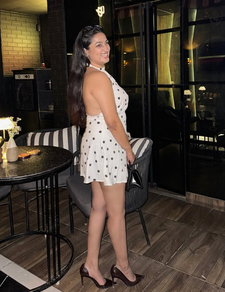 Andora Halterneck Polka Mini Dress - back shot on model, white with black polka dots - Miss Mosa By Akanksha
