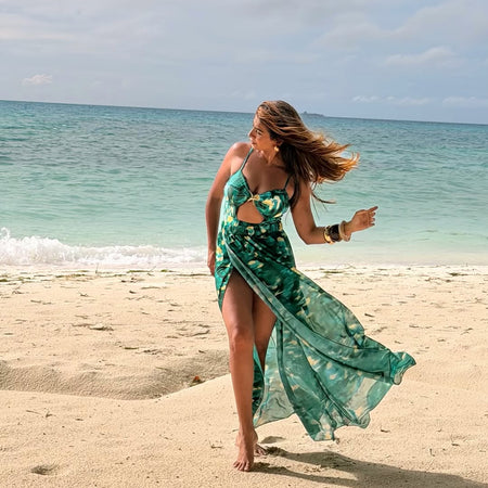 Aspen Swimsuit With Sarong Skirt In Dark Green - front shot on model on beach - Miss Mosa By Akanksha