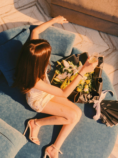 Beatrix Embroidered Mini Dress - overhead seated shot on model, cream ivory with tonal floral embroidery - Miss Mosa By Akanksha
