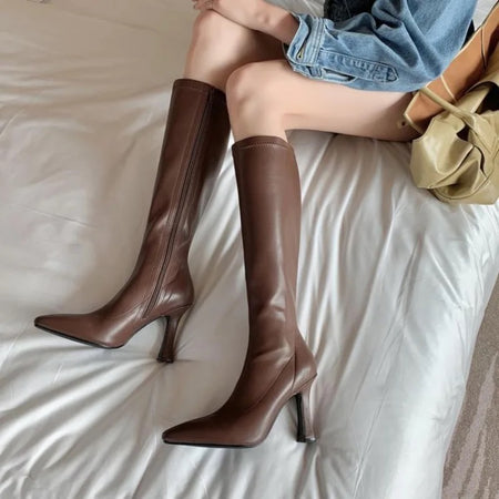 Blythe Pointed Leather Boots - seated front shot on model, brown - Miss Mosa By Akanksha