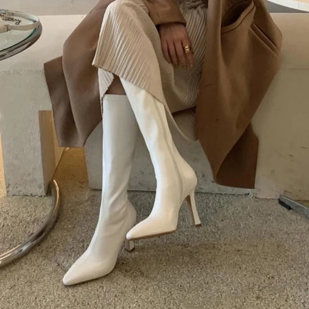 Blythe Pointed Leather Boots - seated side shot on model, cream - Miss Mosa By Akanksha