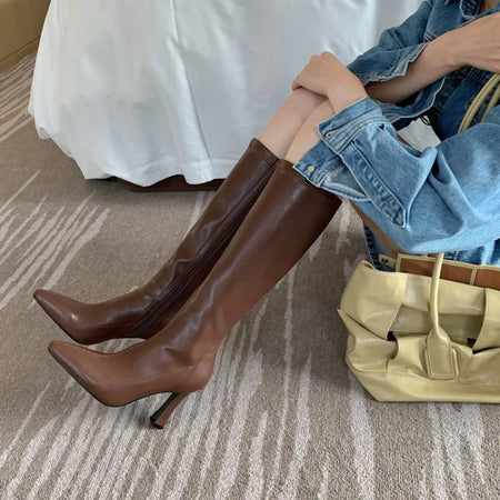 Blythe Pointed Leather Boots - seated front shot on model, brown - Miss Mosa By Akanksha