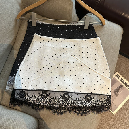 Britt Lace Polka Skorts - front shot on a hanger, white with black polka dots and black lace trim - Miss Mosa By Akanksha