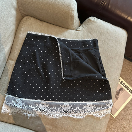 Britt Lace Polka Skorts - flat-lay shot, black with white polka dots and white lace trim - Miss Mosa By Akanksha