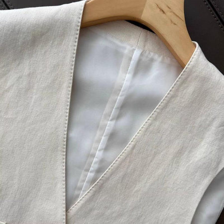 Brizo Statement Vest Suit With Pants In Beige - close-up of vest V-neckline detail - Miss Mosa By Akanksha