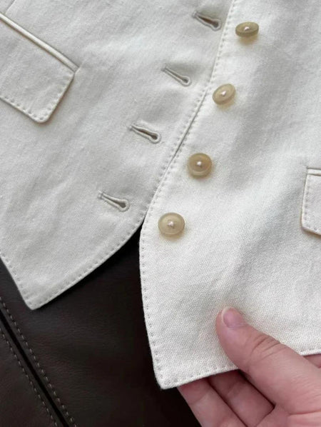 Brizo Statement Vest Suit With Pants In Beige - close-up of vest hem and buttons detail - Miss Mosa By Akanksha