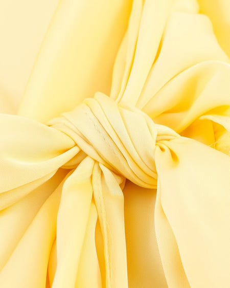 Bruna Halterneck Cowl Mini Dress - flat-lay knot detail shot, pale yellow - Miss Mosa By Akanksha