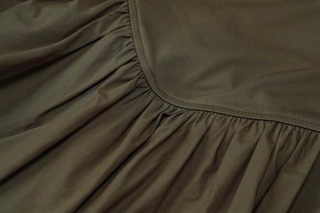 Camille Statement Balloon Dress In Olive - close-up shot of skirt seam detail - Miss Mosa By Akanksha