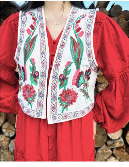 Cari Statement Vest Top In Beige - front shot on model worn over red dress - Miss Mosa By Akanksha
