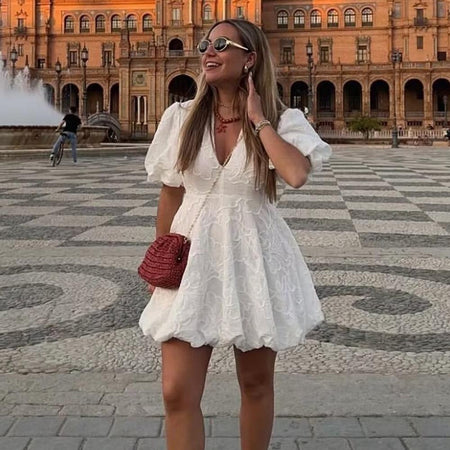 Carly Summer Holiday Dress In White - full-length front shot on model in a plaza - Miss Mosa By Akanksha