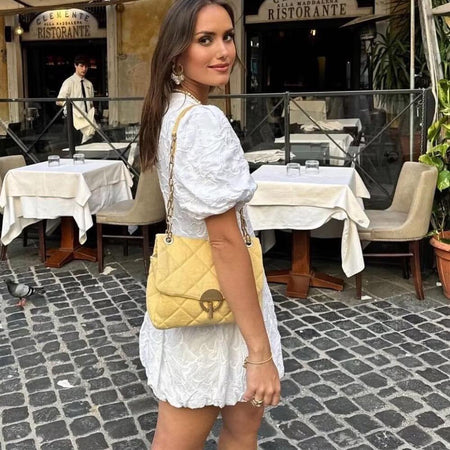 Carly Summer Holiday Dress In White - front shot on model in a plaza - Miss Mosa By Akanksha