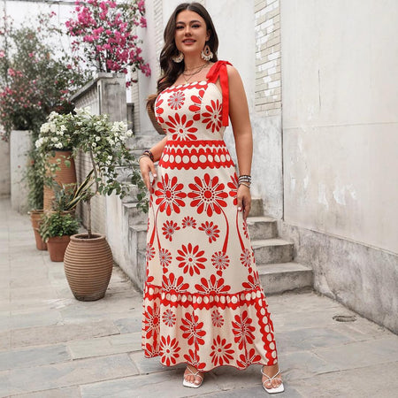Catherine Floral Holiday Dress In Orange - full-length front shot on model in a courtyard - Miss Mosa By Akanksha