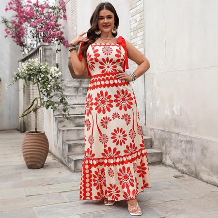 Catherine Floral Holiday Dress In Orange - full-length front shot on model in a courtyard - Miss Mosa By Akanksha
