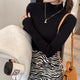 Champel Statement Turtleneck Sweater - front shot on model, black - Miss Mosa By Akanksha