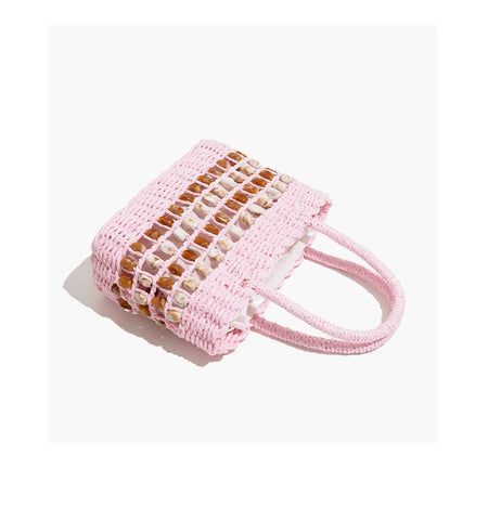 Coco Straw Beads Hand Bag With Pouch - angled flat-lay shot, pink with amber and cream shell beads - Miss Mosa By Akanksha