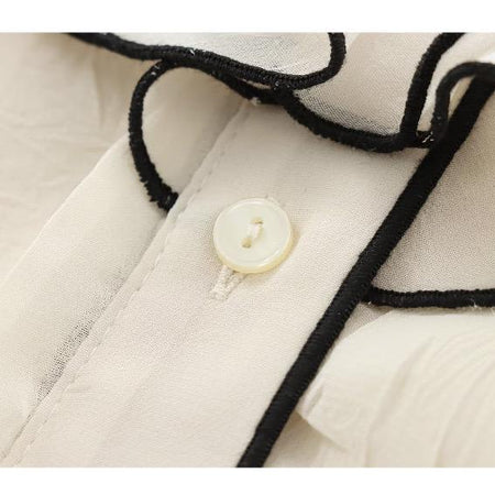 Corin Ruffled Summer Top In Off-White - close-up shot of ruffle and button detail - Miss Mosa By Akanksha