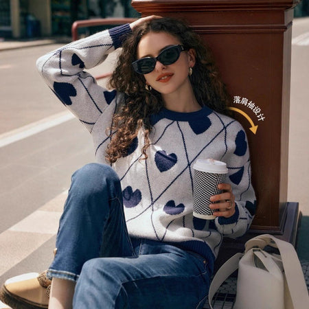Cosette Heart Woolen Sweater - front shot on model seated, off-white and navy blue - Miss Mosa By Akanksha