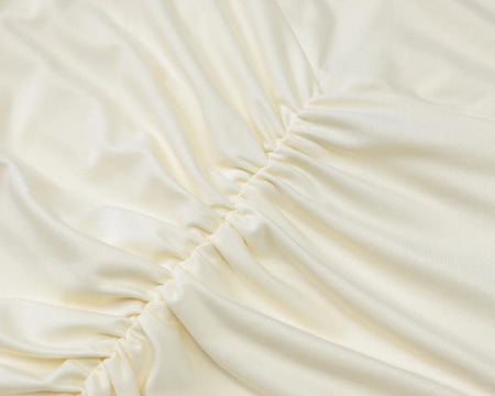 Cosmic Offshoulder Ruched Maxi Dress In Off-White - close-up of ruched fabric detail - Miss Mosa By Akanksha