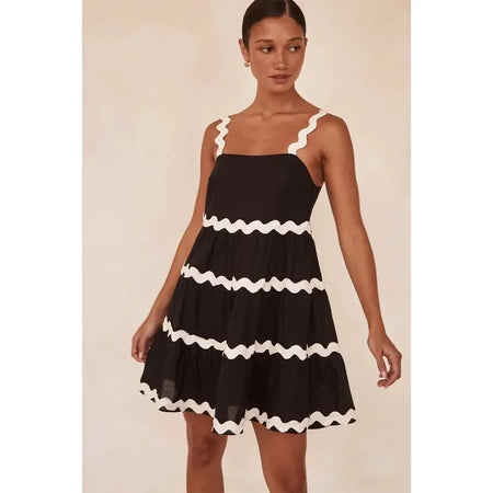 Coya Statement Holiday Dress In Black - lifestyle shot on model, black - Miss Mosa By Akanksha