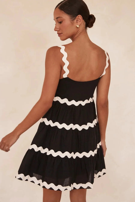 Coya Statement Holiday Dress In Black - back shot on model, black - Miss Mosa By Akanksha