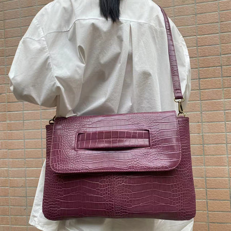 Cruz Textured PU Clutch Bag With Belt - crossbody shot on model, plum purple - Miss Mosa By Akanksha