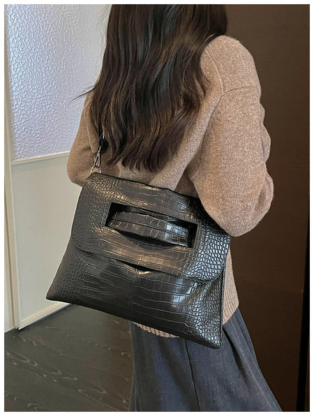 Cruz Textured PU Clutch Bag With Belt - crossbody shot on model, black - Miss Mosa By Akanksha
