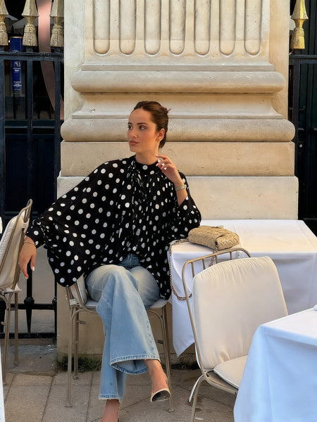 Cyrilla Polka Oversized Top - seated shot, black with white polka dots - Miss Mosa By Akanksha