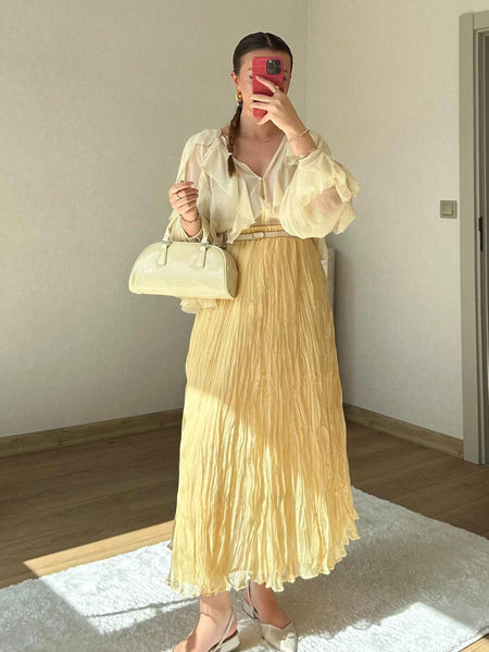 Daisy Summer Skirt in Yellow - full-length shot on model holding bag - Miss Mosa By Akanksha