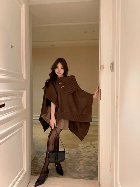 Dera Premium Winter Capes In Brown - full-length shot on model in doorway - Miss Mosa By Akanksha