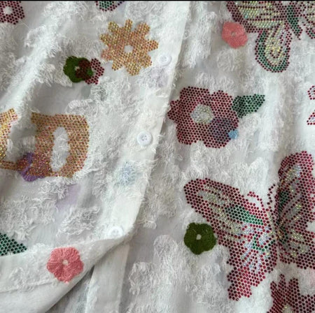 Derry Rhinestone Oversized Shirt In White - close-up of the rhinestone butterfly and floral detail - Miss Mosa By Akanksha