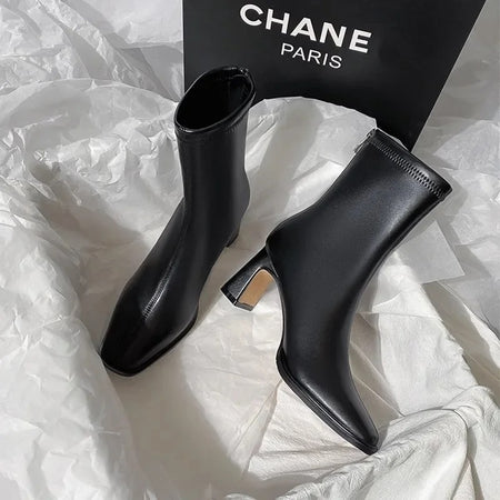 Desse Short Leather Statement Ankle Boots - styled flat-lay shot, black - Miss Mosa By Akanksha