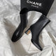 Desse Short Leather Statement Ankle Boots - styled flat-lay shot, black - Miss Mosa By Akanksha