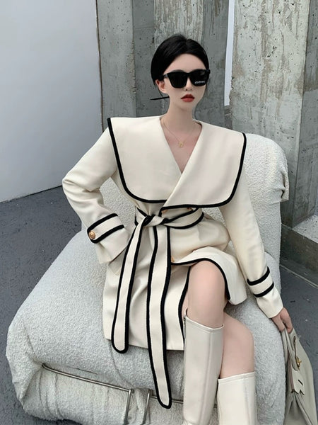 Disbo Oversized Woolen Overcoat - front shot on model seated, cream - Miss Mosa By Akanksha
