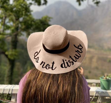 Do Not Disturb Straw Hat In Cream - lifestyle shot on model, cream - Miss Mosa By Akanksha