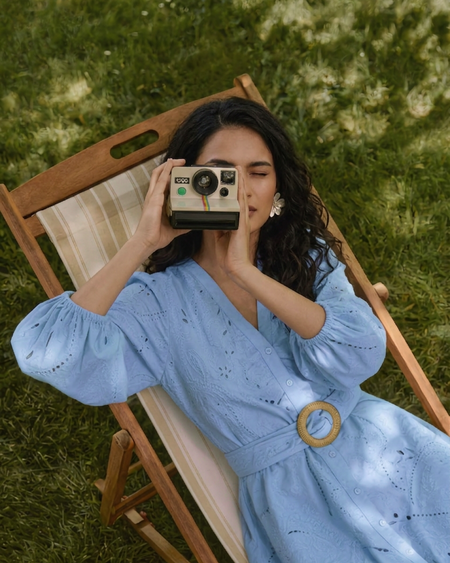 Donella Eyelet Mini Dress With Belt - seated overhead shot, light blue - Miss Mosa By Akanksha