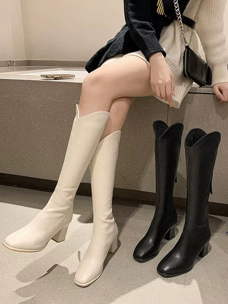 Drobe Premium Leather Boots with Heel - boots shot on and beside model, cream and black - Miss Mosa By Akanksha